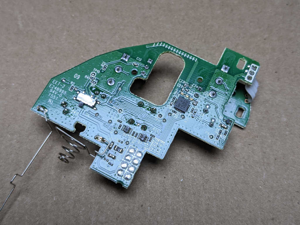 Figure 4 — 4 — A trackball's internal PCB and sensor exposed — illustrating the harvest of Logitech Marble electronics the DFCD reuses. Photo via web search (personal-reference use).
