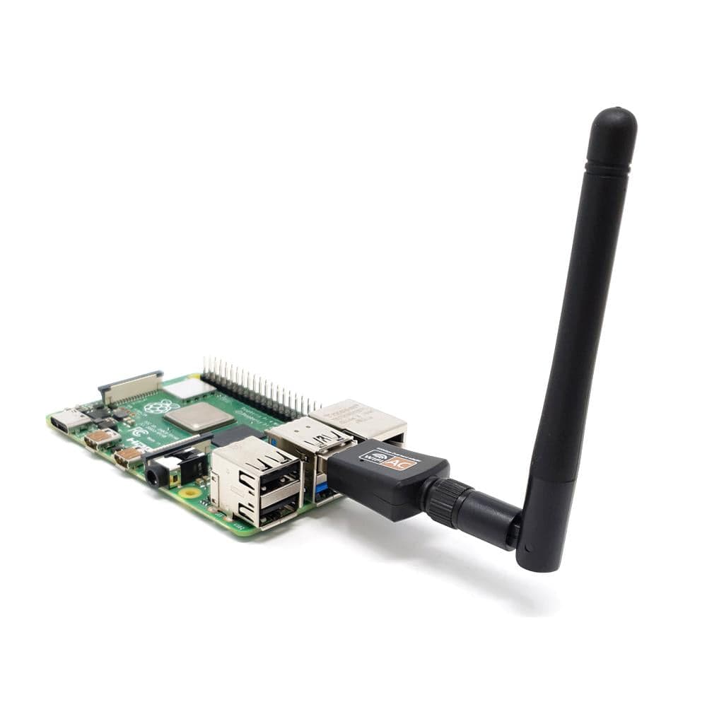 Figure 10 — 10 — A USB WiFi adapter with an external screw-on antenna, representative of the External WiFi Mod's internal-adapter-plus-external-antenna arrangement. Photo via web search (personal-refe…