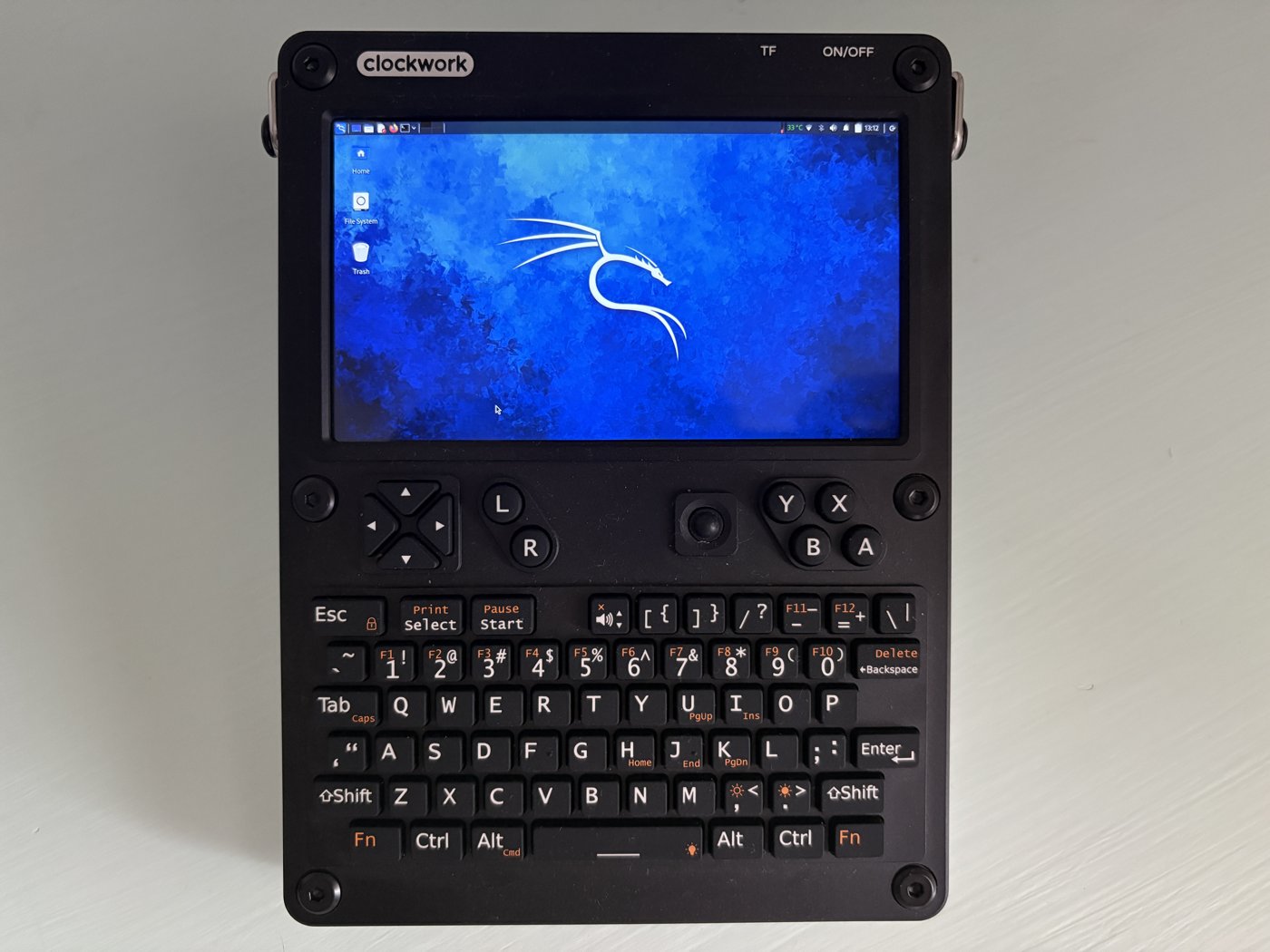 Figure 7 — 7 — The ClockworkPi uConsole, the sibling handheld cyberdeck, for a sense of the PiFlux's relative size. Photo via packetwanderer.com (web search; personal-reference use).